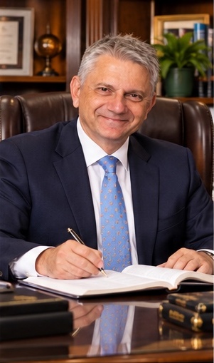Rev. Bignardi writing at his desk